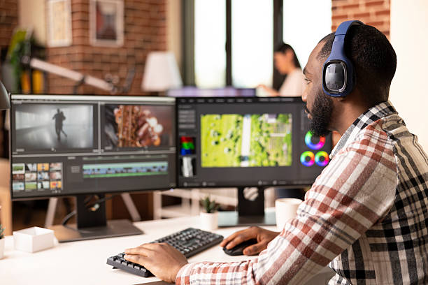 istock Sound editor wearing headphones and editing audio content 2233586093