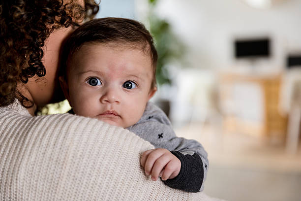 istock Tender Moment: Mother and Baby in Home Interior 2233586097