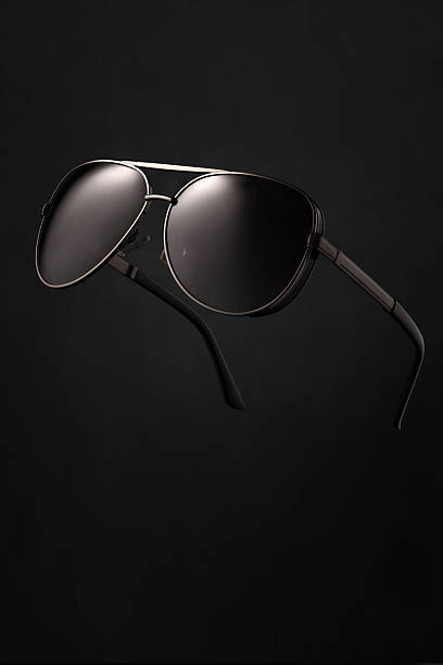 istock Stylish aviator sunglasses on dark background 2233587600