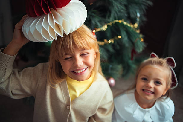 Photo of a beautiful twin sisters on Christmas Eve.