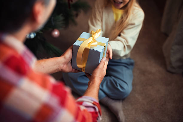istock Family Bonding While Exchanging a Gift During the Holiday Season 2233589482