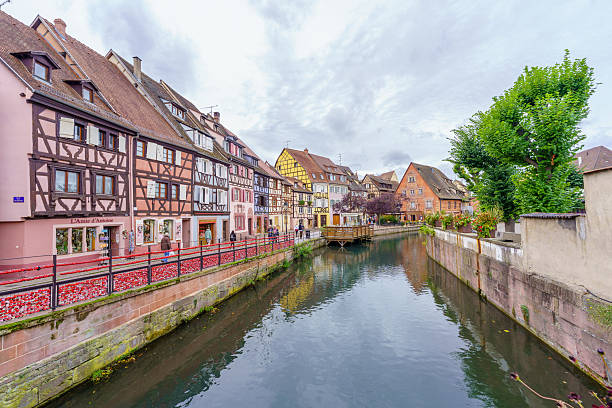 Colmar, France - October 01, 2024: View of Little Venice, with typical houses, locals and visitors, in the old town of Colmar, Haut-Rhin, France