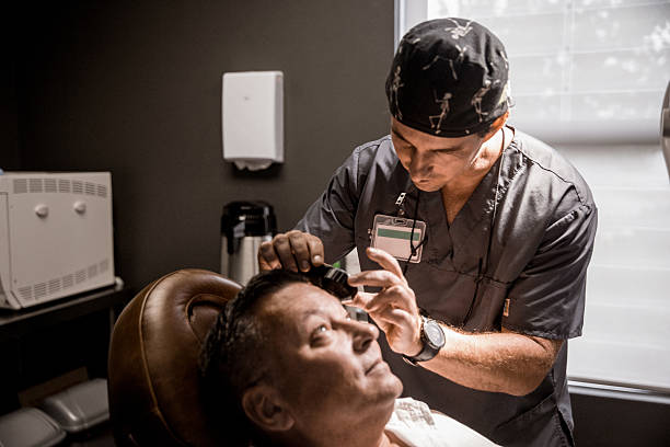 istock Middle-age man having a check-up at the dermatologist 2233592539