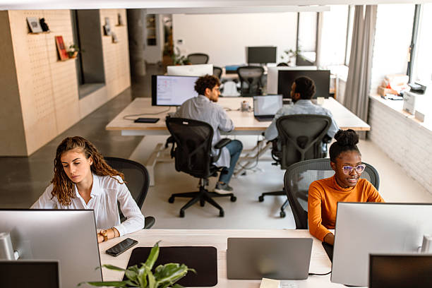 istock Group of programers working on their desktop pc in the office. 2233592985