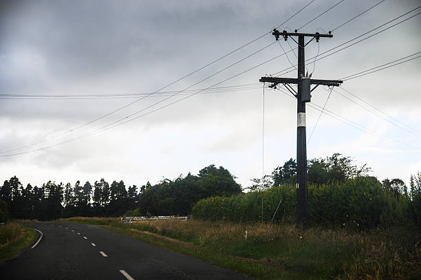 istock Power post and power lines under the stormy sky. Taranaki. 2233594861