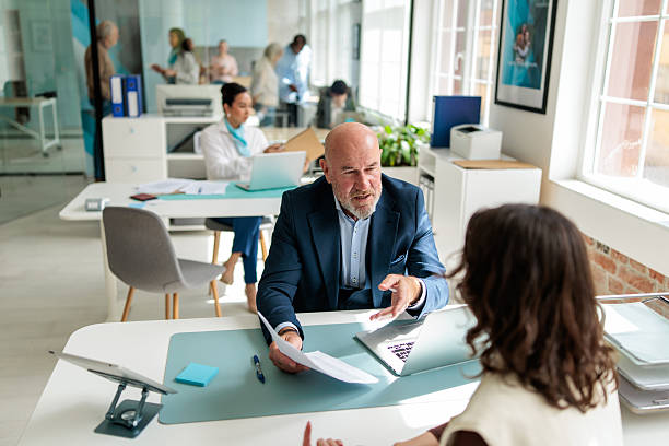 istock Customer Service Consultation Between Banker and Female Client 2233595321