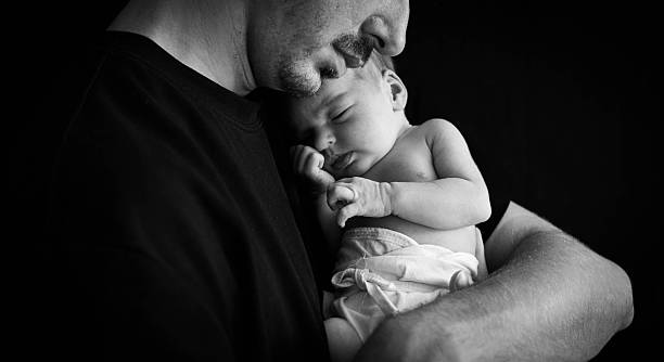 istock Dad and her  newborn daughter 2233595746