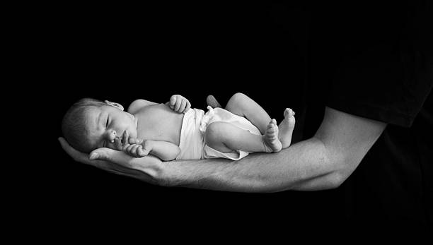 istock Dad and her  newborn daughter 2233595762