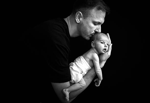 istock Dad and her  newborn daughter 2233595797