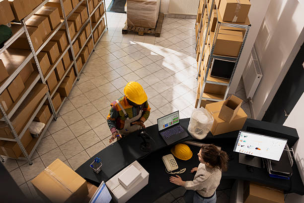 istock Diverse employees team managing storage inventory and preparing orders 2233600786
