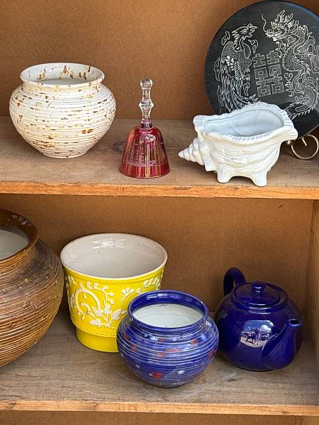 istock Shelves of vases, teapots and planters 2233602600