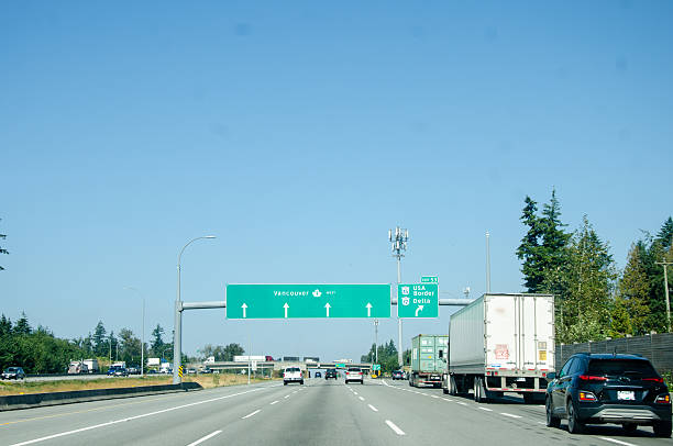 istock Road signage pointing US Border direction 2233608298