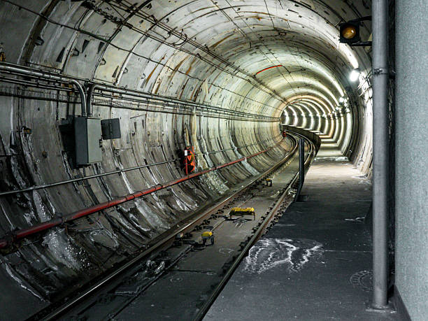 istock Underground Tunnel with Railroad Tracks and Illuminated Interior Components 2233608490