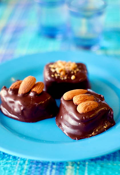 Greek sweets dipped in chocolate with almonds on top. Nikon D300