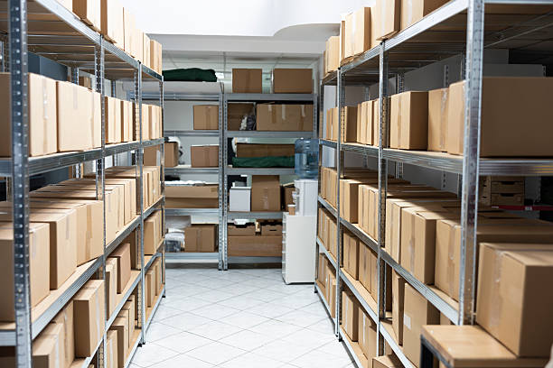 istock Industrial warehouse unit empty filled with boxes of goods and merchandise 2233609777