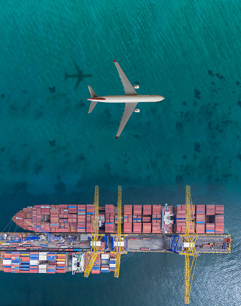 istock Airplane flying over container ship. Transportation concept. Airplane and Container ship. International Port. 2233611822