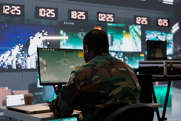 istock Air defense division operative using radar on computer to detect missiles 2233613134