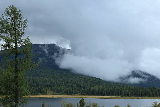 istock Serene Mountain Landscape with Cloud Cover and Tranquil Lake 2233613841