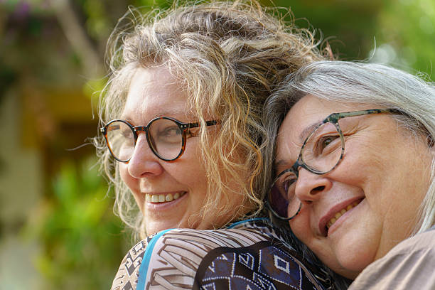istock Two smiling senior women embracing outdoors, showing affection and happiness celebrating their love and lgbtq pride 2233614455