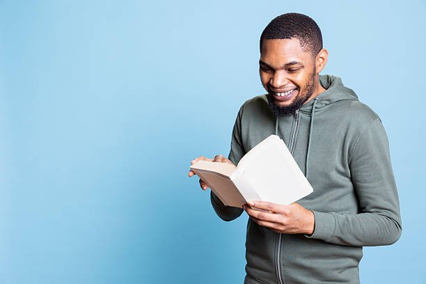 istock African american bookworm engrossed in his reading leisure time 2233615755