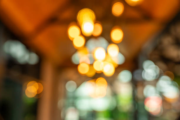 Blurred cafe and restaurant background featuring cozy atmosphere, coffee shop tables, and natural light. Perfect for remote working, creative design, lifestyle mockups, and presentation backdrops.