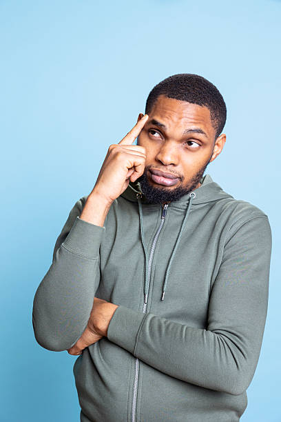 istock Pensive african american guy acting curious and uncertain about something 2233617903