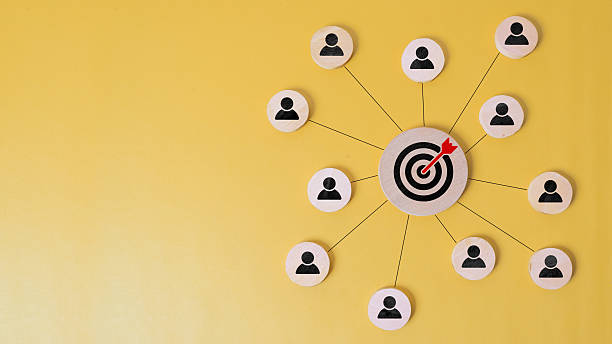 istock Customer relationship management concept. wooden block with target icon linked with human icons for customer focus group. Data exchanges development and customer service 2233617929