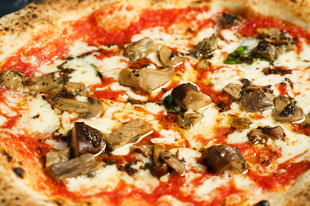 Neapolitan pizza with porcini mushrooms and mozzarella