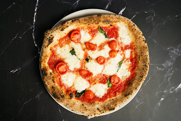 Neapolitan pizza with cherry tomatoes and mozzarella