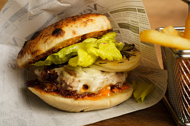 istock Beef burger with grilled onions and fries 2233620258