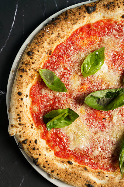 istock Traditional margherita pizza with fresh basil 2233620262