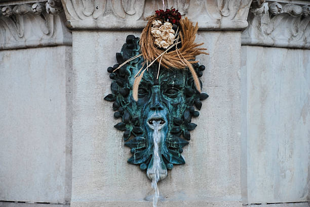Zagreb, Croatia - August 27, 2012 - Ornate green man fountain sculpture with decorative elements.