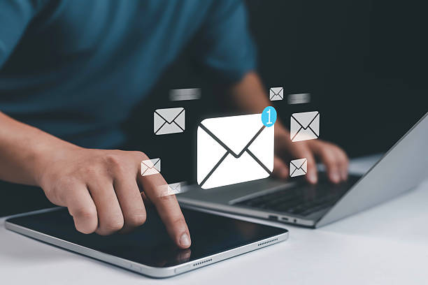 istock Digital email communication concept with new message notification icon on mobile and laptop, symbolizing online messaging, business mail, marketing, customer connection, and modern communication. 2233624653