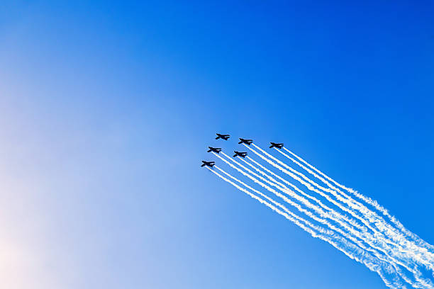 Approaching Blue Angels, also referred to as the U.S. Navy Flight Demonstration Squadron, four Boeing FA-18 Super Hornet jets flying in formation against a clear blue sky at an air show at the Naval Air Facility,  El Centro, California.  Photography date: March 16, 2019.