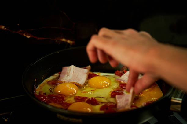istock cooking scrambled eggs in a frying pan 2233625594