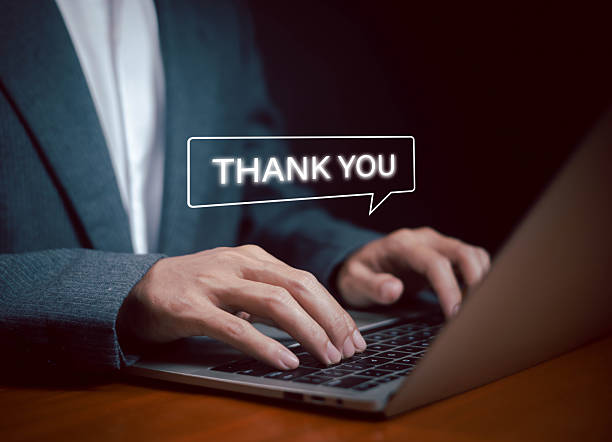 istock Businessman typing on laptop with thank you text message speech bubble, symbolizing online communication, customer support, gratitude, email marketing, and professional business concept. 2233629180
