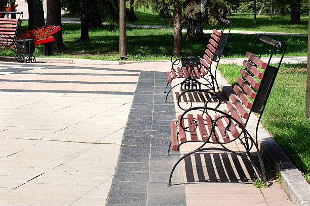 istock Two Brown Wooden Park Benches Without People 2233629459