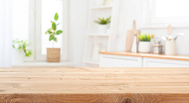 istock Rough wooden texture board in front of blurred rustic kitchen corner interior background 2233633018