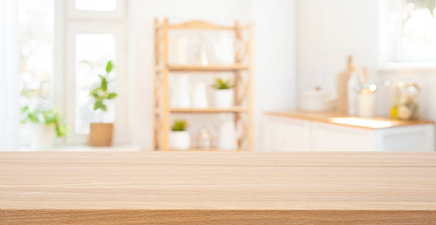istock Wooden table top on blurred bright and sunny rustic kitchen interior background 2233633038