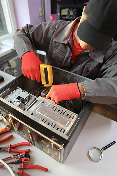 istock Senior Man 50+ Fixing Electronics in Computer Repair Shop 2233633927