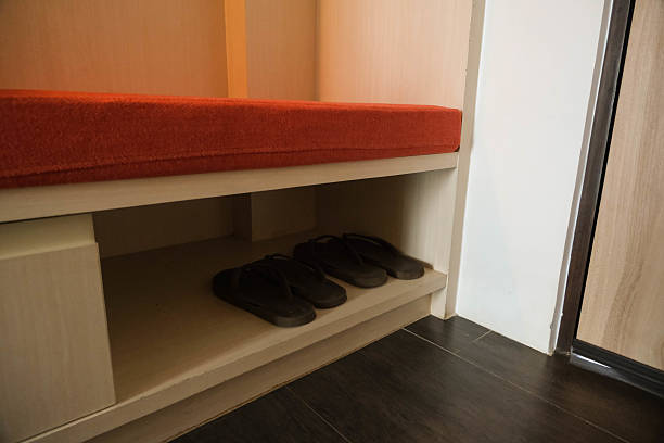 istock Slippers on the shoe rack in a hotel room 2233635933