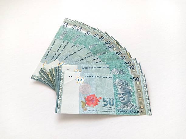 istock Malaysia Currency (MYR): Stacking of 50 Ringgit Malaysia bank note which isolated with white background. 2233636598