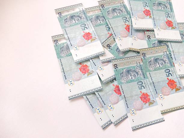 istock Malaysia Currency (MYR): Stacking of 50 Ringgit Malaysia bank note which isolated with white background. 2233636605