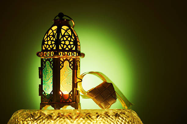 istock arabic lantern and ribbon ketupat on green background 2233637841