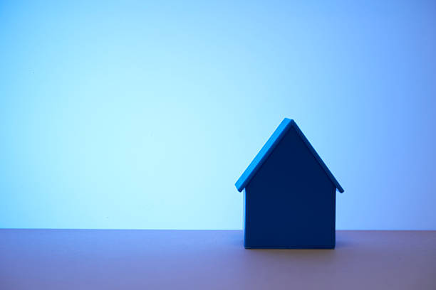 istock blue color model house against blue background 2233639854