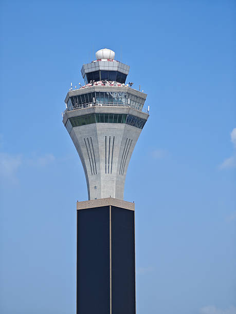 istock Beijing Capital Airport Tower under clear blue sky 2233647957
