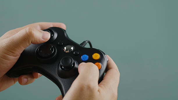istock Playing games with joystick control and fun. Online gaming concept. Playing video games with joystick. 2233648609