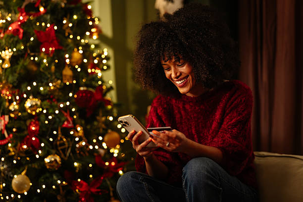 istock Young Woman Shopping Online During Christmas 2233651124