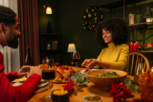 istock Couple Enjoying a Festive Holiday Dinner Together 2233651169