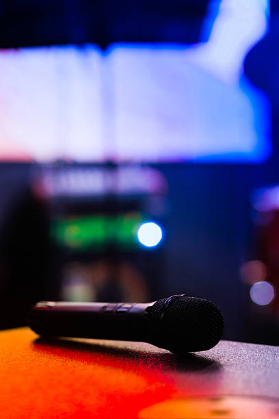 istock Close-Up Microphone on Colorful Stage with Blurred Background 2233651255